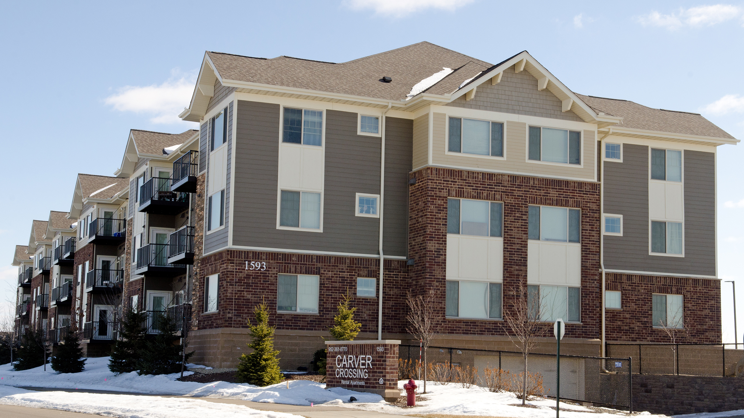 Once angrily opposed by many neighbors, the Carver Crossing apartment complex in Carver, Minn., has become an accepted part of the community.