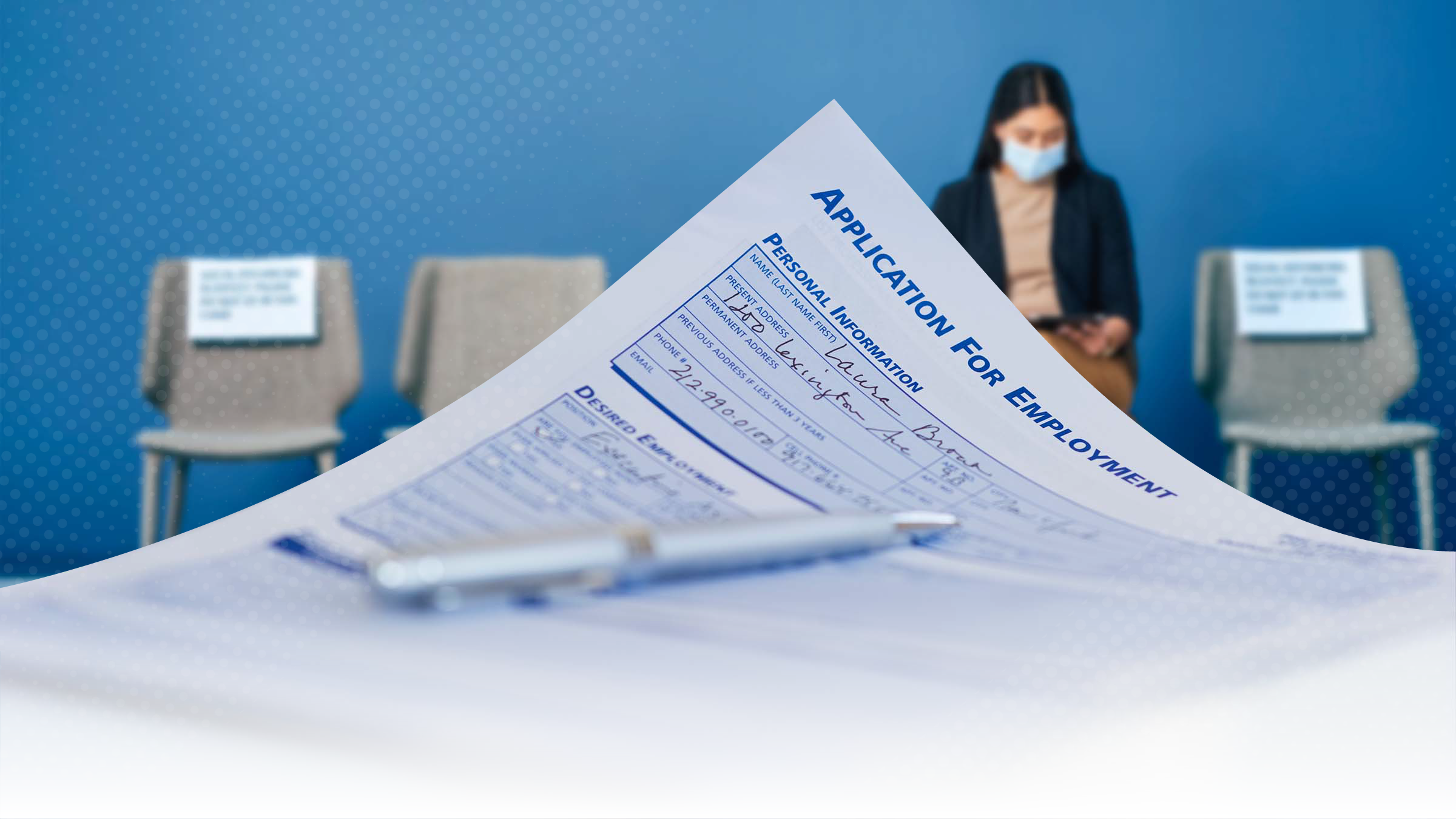 Job application in the foreground, lone applicant in the background