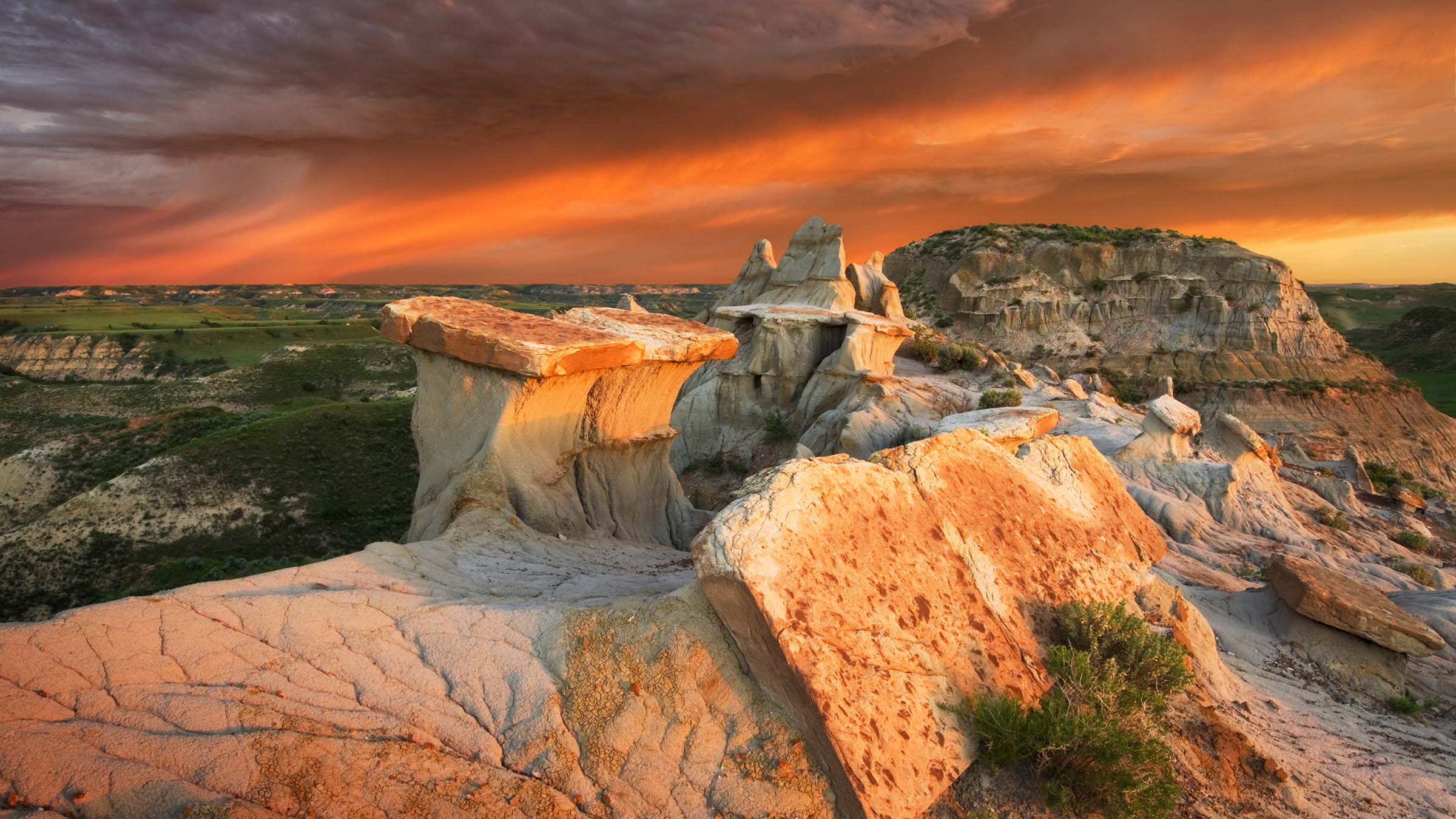 Clearing storm at sunrise over badlands sandstone formations, Theodore Roosevelt National Park, North Dakota.