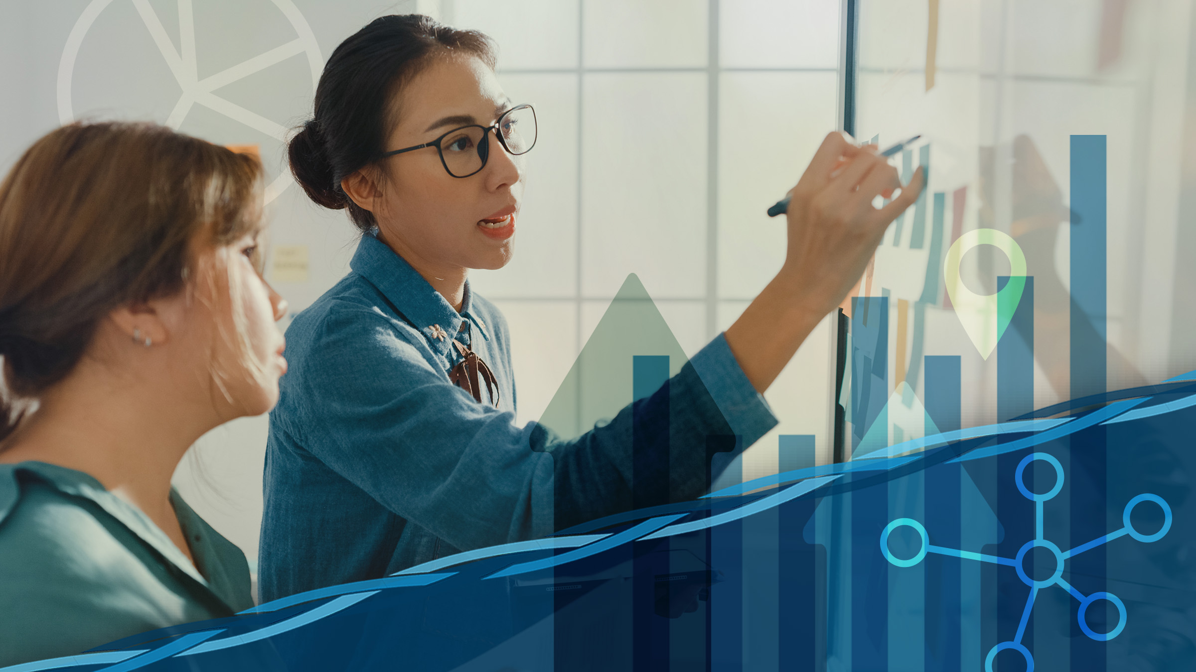 Decorative image featuring two young Native women, seen in profile, standing in front of a white board. One of the women writes on the board and speaks as the other woman looks on and listens. Large icons representing data and research appear as background or overlay elements.