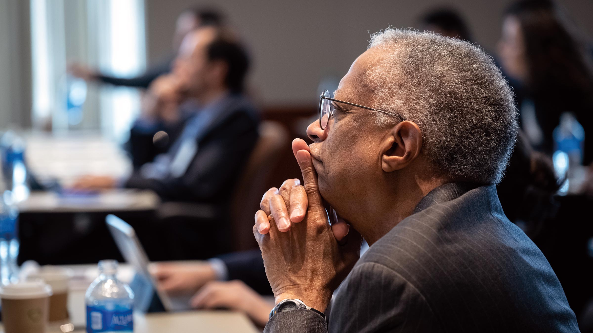 Photo of Bill Spriggs watching conference
