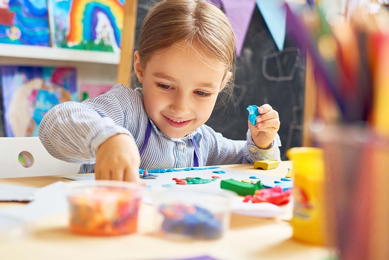 Pay for Success for ECD, preschool girl at art table