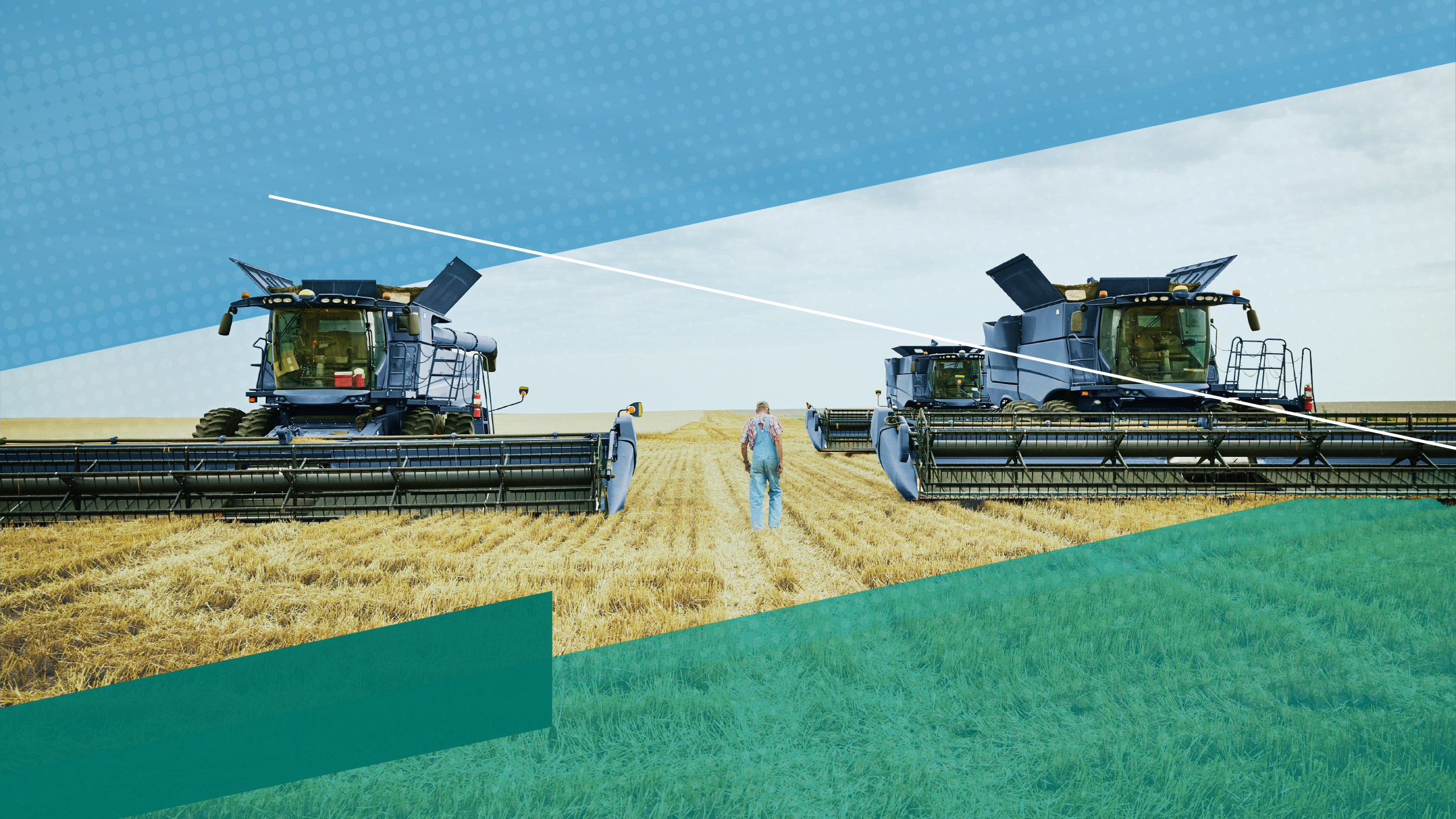 farmer walking between two combines in a wheat field